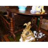 A Victorian Sutherland table on turned supports