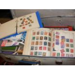 A suitcase full of stamp albums and stamp referenc
