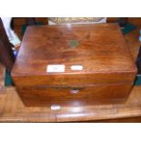 A rosewood work box with fitted interior