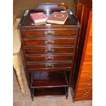 An Edwardian five drawer music cabinet