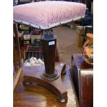 A Victorian rosewood revolving piano stool