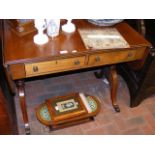 An antique mahogany sofa table with two drawers to