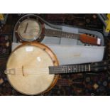 An old eight string banjo in fitted carrying case,