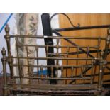 A Victorian brass bedstead with side irons - 136cm