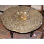 A decorative 76cm diameter Middle Eastern table on