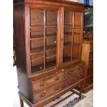 A 19th century mahogany bookcase with four drawers