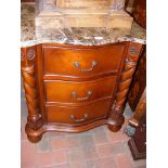 A Victorian style mahogany and marble top three dr