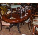 A Victorian mahogany extending dining table with t