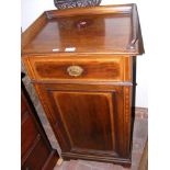 An Edwardian mahogany pot cupboard with drawer to