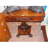 A 19th century rosewood fold-over games table with