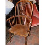 An antique stick back country chair with crinoline