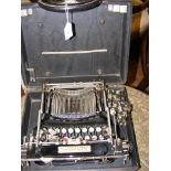 A vintage Smith & Corona typewriter in carrying ca