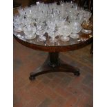 A 19th century rosewood breakfast table with shape