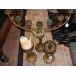 An ecclesiastical pair of brass candle holders, to