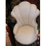 A shell back easy chair