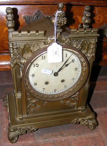 A brass Gothic style mantel clock - 39cm high