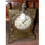 A brass Gothic style mantel clock - 39cm high