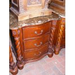 A Victorian style mahogany and marble top three dr