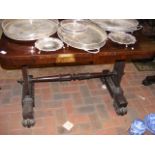 A 19th century rosewood library table with shaped