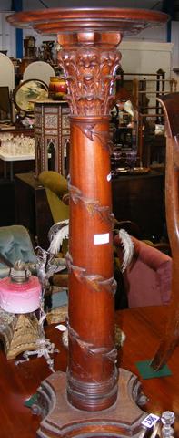 A pair of 19th century carved column torchere stan