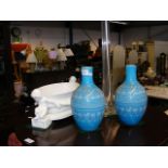 A pair of blue glass vases, cherub table centre, t