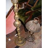 A pierced brass Middle Eastern standard lamp, toge