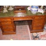 Antique pedestal desk, the centre drawer stamped "
