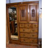 An Edwardian combination wardrobe with mirrored do