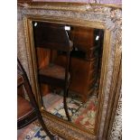 A decorative gilt framed wall mirror - 120cm x 88c