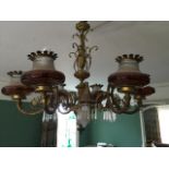 A decorative gilt metal six branch ceiling light w