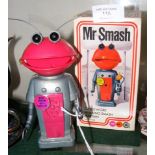 An original "Mr Smash" clockwork toy with box