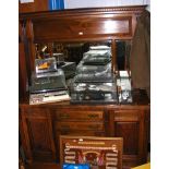 An antique mirrored back sideboard with drawers an