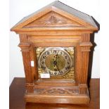 An oak cased chiming mantel clock - 42cm high