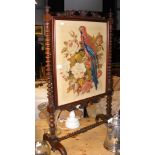 A Victorian rosewood fire screen with embroidery p