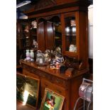 An Edwardian sideboard with mirrored back and draw