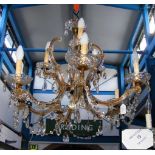 A decorative six branch crystal drop chandelier