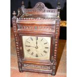 An oak cased mantel clock - 28cm high