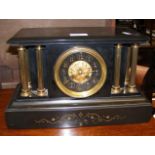 A Victorian slate mantel clock with striking movem