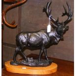 A cast metal model Stag on wooden plinth