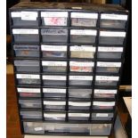 A 33 drawer plastic cabinet containing a quantity