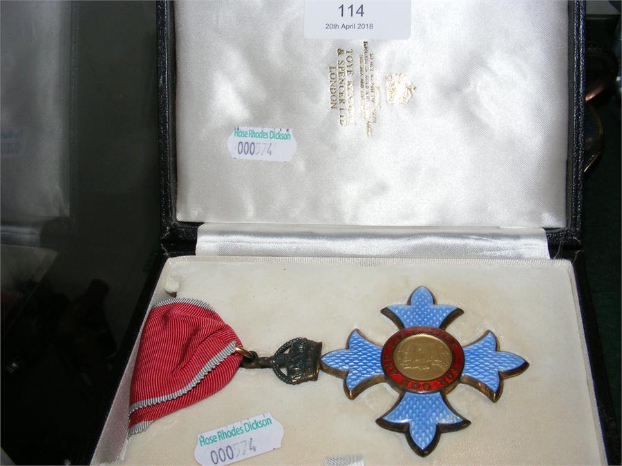 A boxed CBE