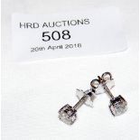 A pair of 18ct gold diamond stud earrings - 1.00ct