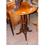 A circular mahogany wine table