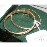 Lady's gold bangle and one other