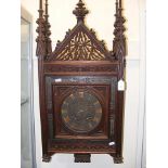 Victorian carved oak wall clock of Gothic revival