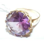 A large amethyst ring in gold setting