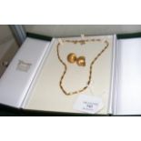 A lady's elegant gold necklace in presentation cas