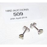 A pair of 18ct gold diamond stud earrings - .85ct