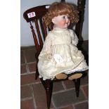 An antique bisque head doll - marked K & H to the