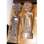 A 58cm carved wooden African figure and one other